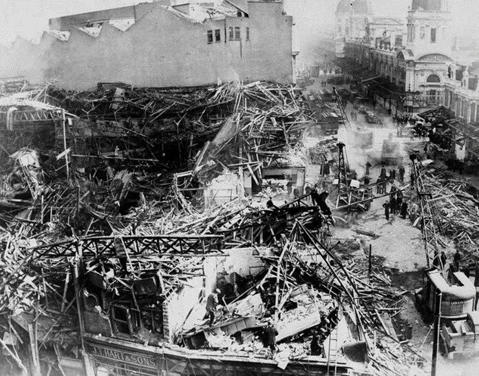 An archival photograph showing the aftermath of a V-2 rocket strike in London.