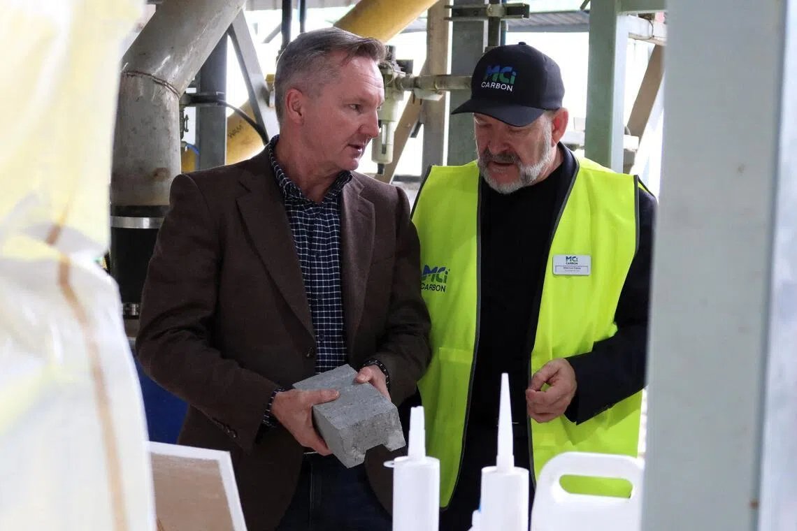 Australian Energy Minister Chris Bowen (left) and MCI Carbon's CEO Marcus Dawe at the carbon refinery facility in Newcastle, Australia, on June 17