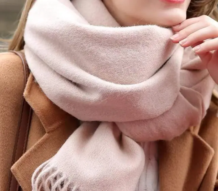 Wool yarn spools in a textile factory. From December 2027, certified wool scarves must comply with the new Materials Matter Standard (MMS), replacing RWS. Ask suppliers about MMS transition and transaction certificates now for Autumn/Winter 2027 orders.