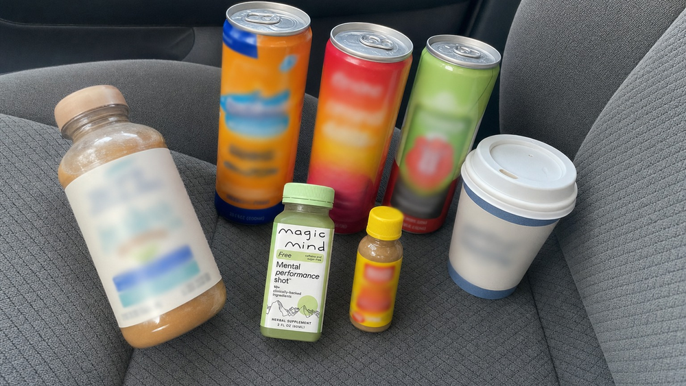 Energy drinks and a Magic Mind FREE bottle on a car seat