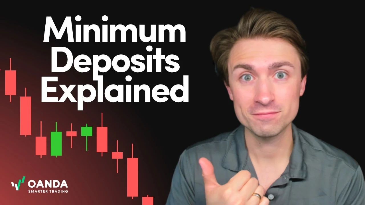 OANDA account management tutorial thumbnail with bold white text reading 'Minimum Deposits Explained'. An expressive presenter stands on the right beside a dark background with red and green candlestick price charts, with the official OANDA logo displayed