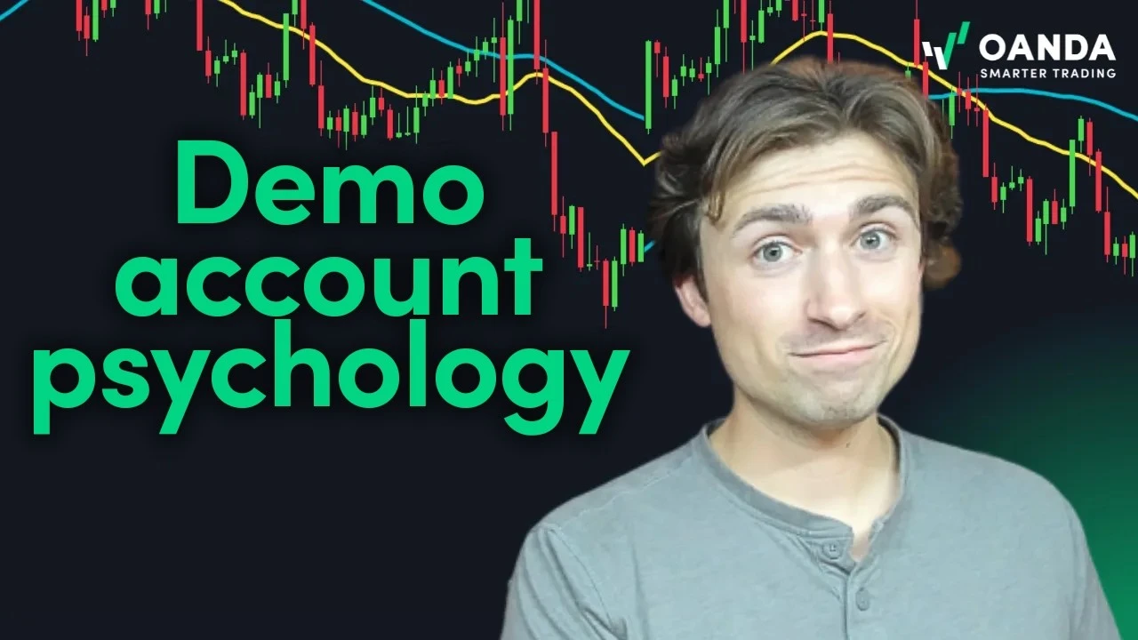 OANDA educational video thumbnail with bold green text reading 'Demo account psychology'. An expressive presenter stands beside a dark financial candlestick chart background, illustrating paper trading mindset and execution discipline.