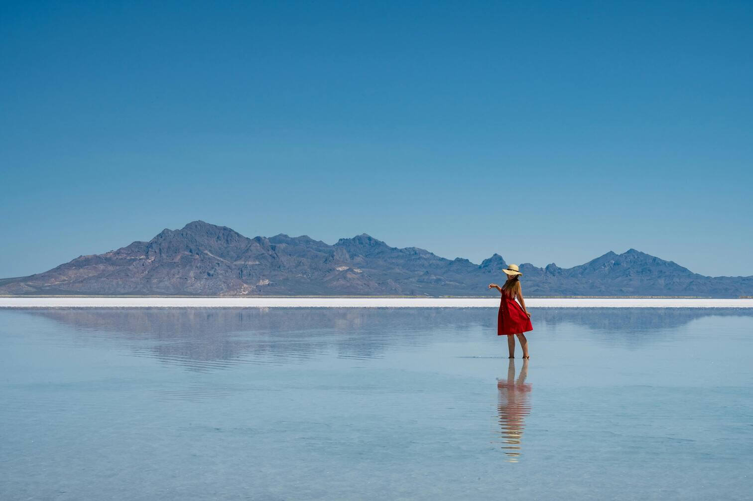 women in red dress in the salt flats