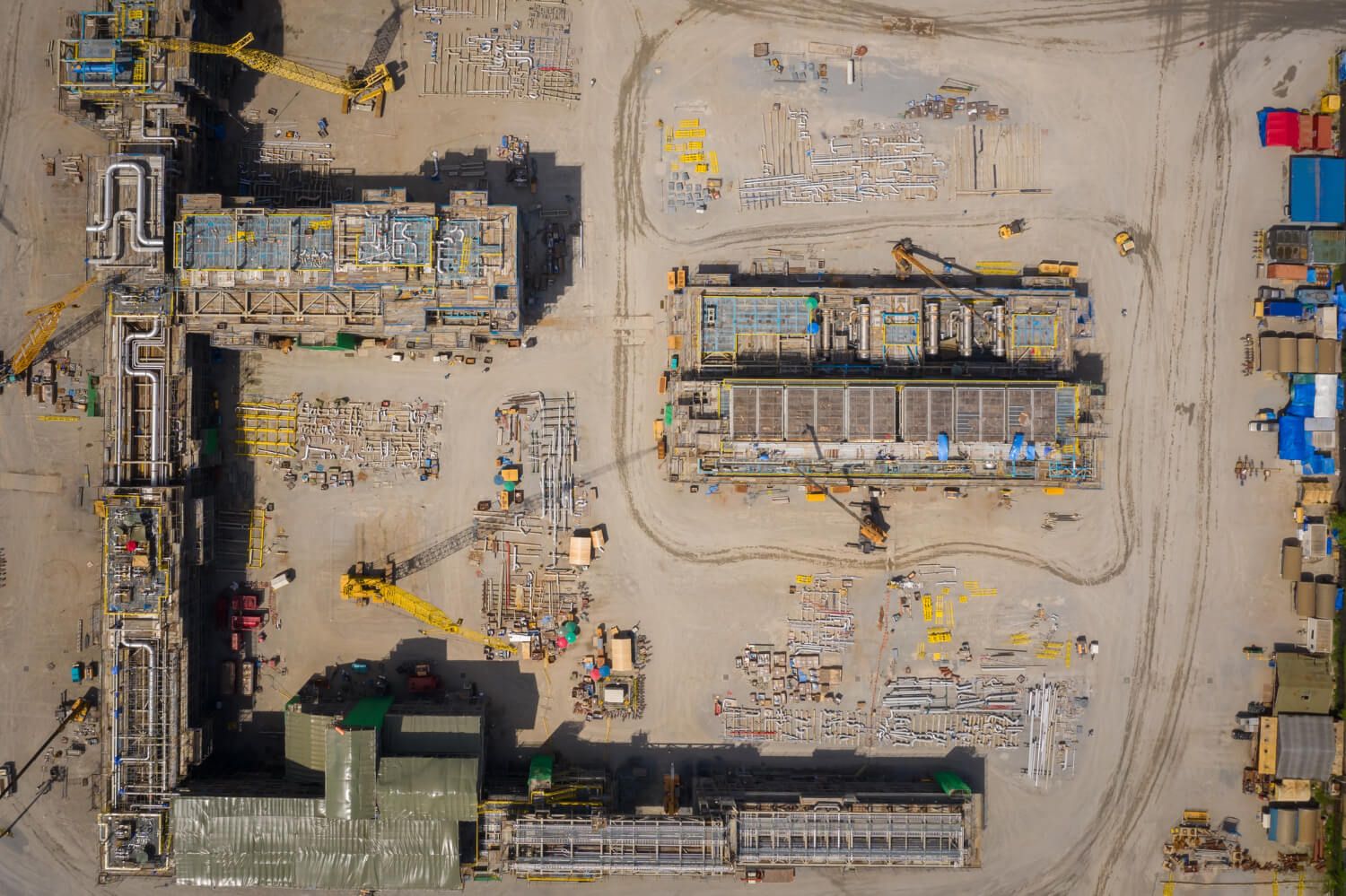 A drone's aerial view showcasing a construction site with detailed infrastructure