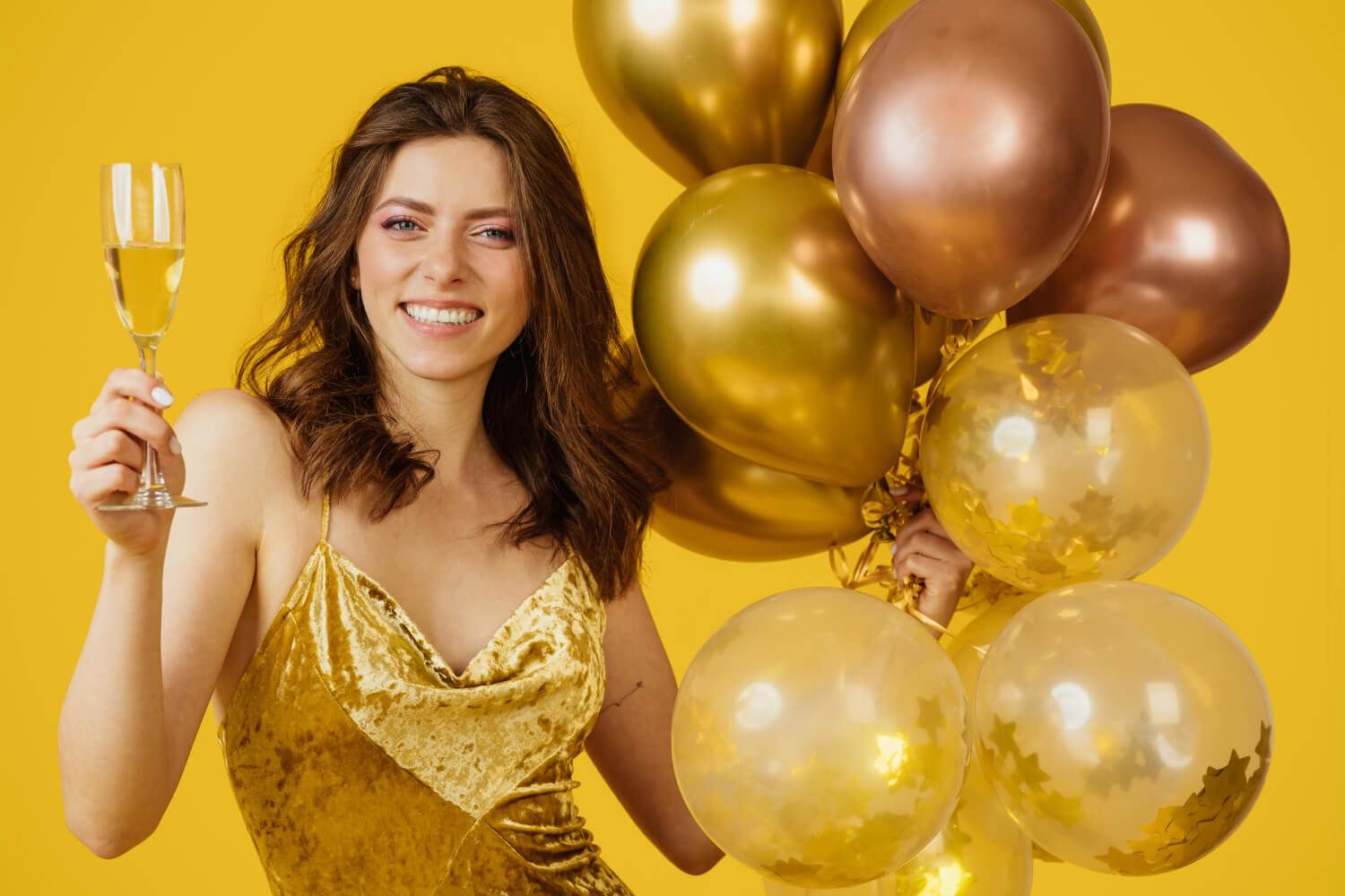 Celebratory cheers with birthday balloons in the background.