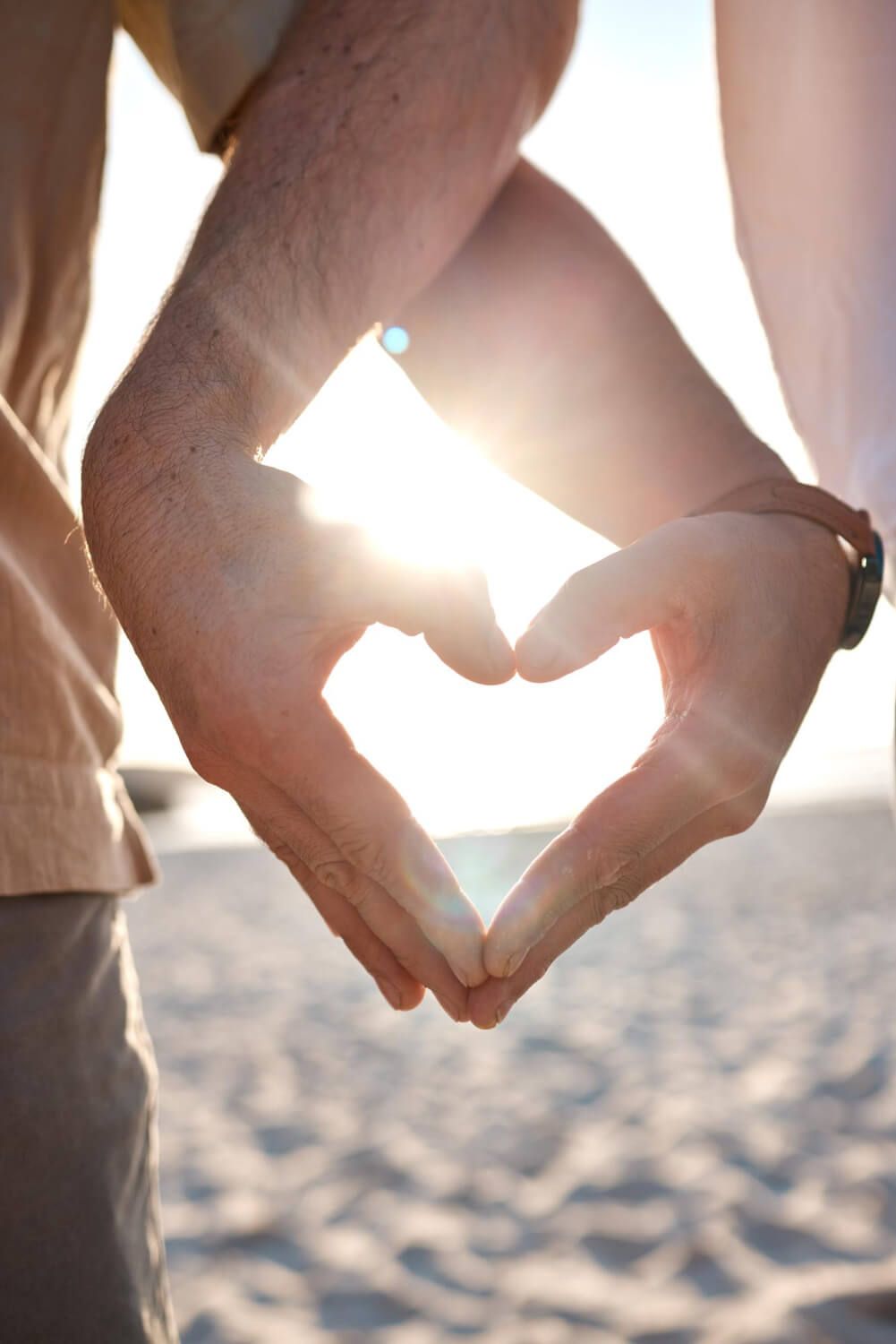 Close-up of a couple holding hands symbolizing love and connection