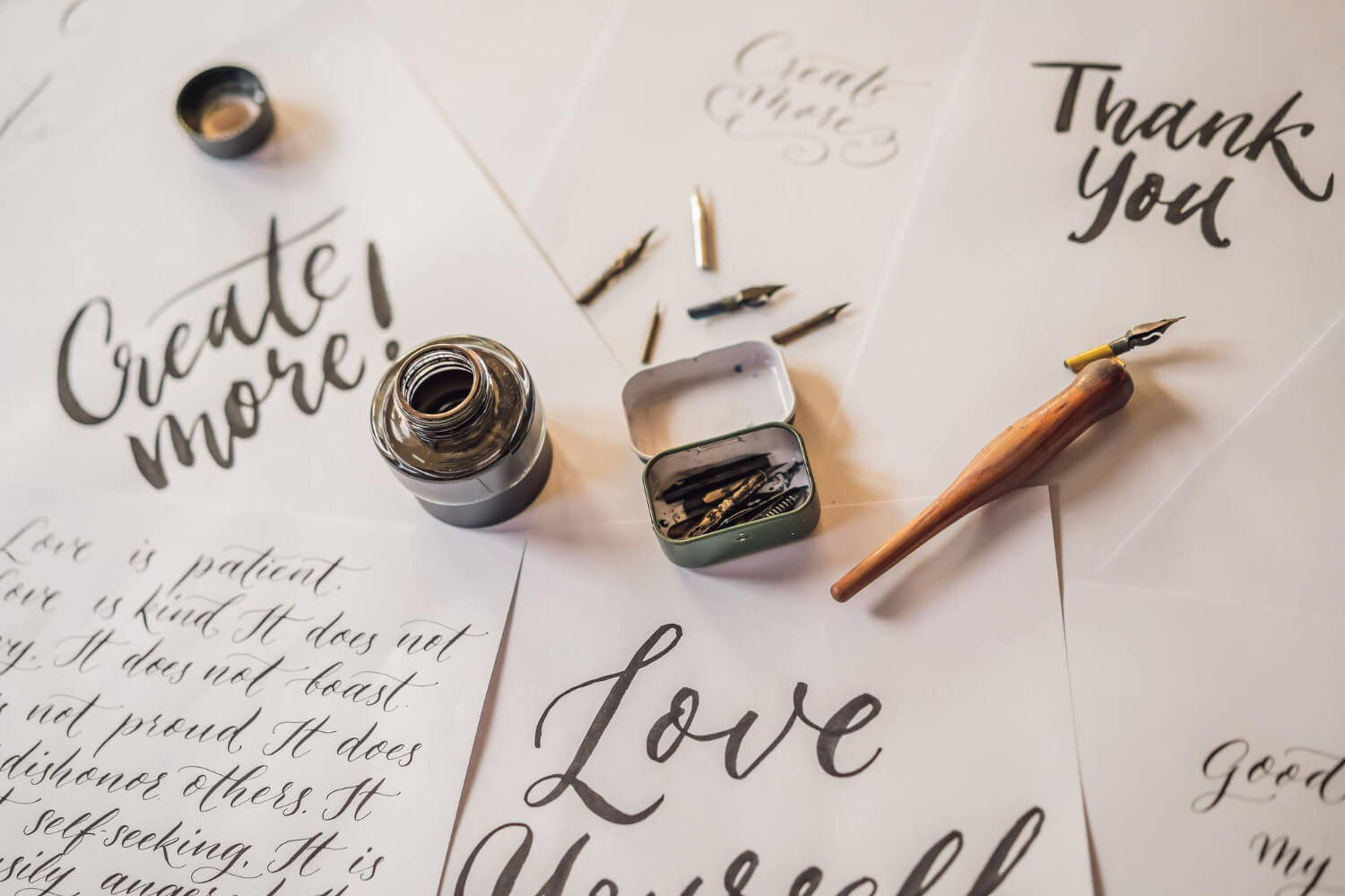 Elegant handwritten quote with a feather quill