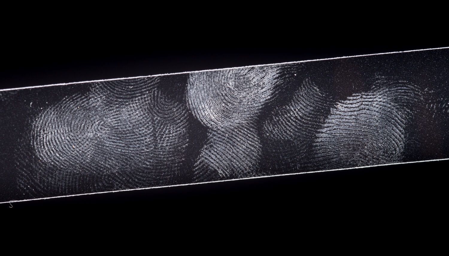 Fingerprints and scratches visible on a glossy print surface.jpg