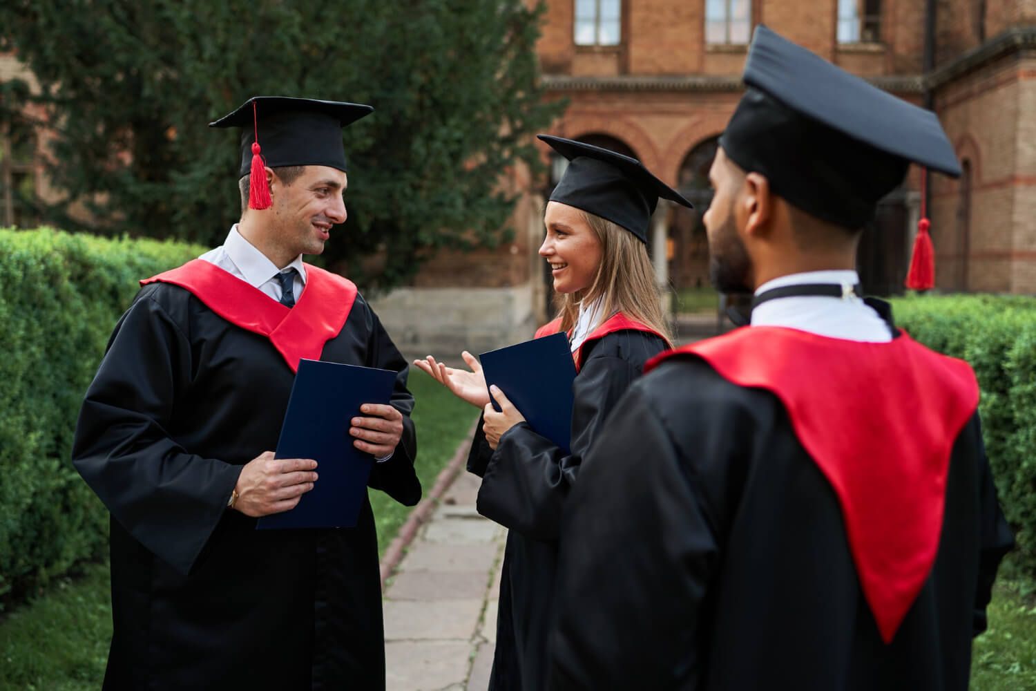 Group of graduates discussing tassel position