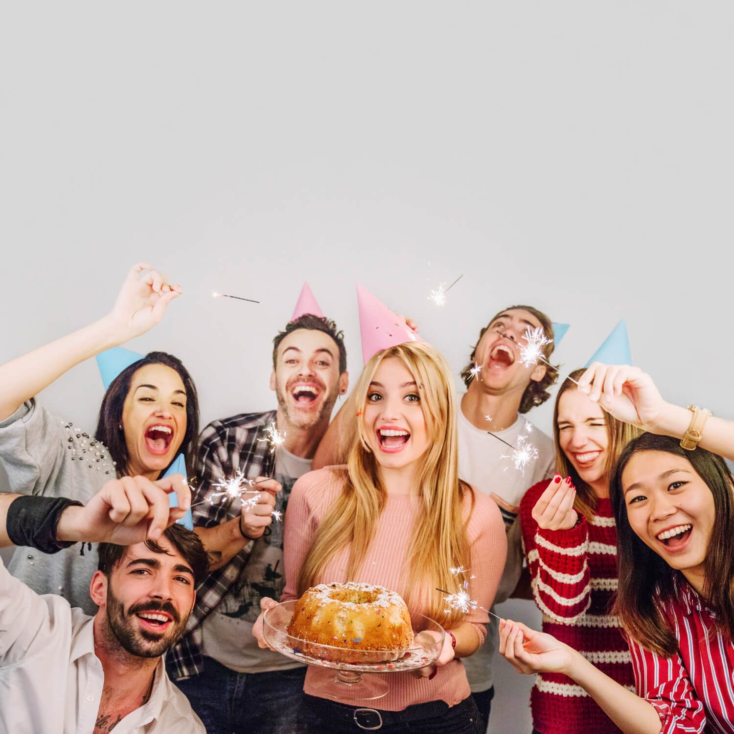 Group of happy friends celebrating a birthday.