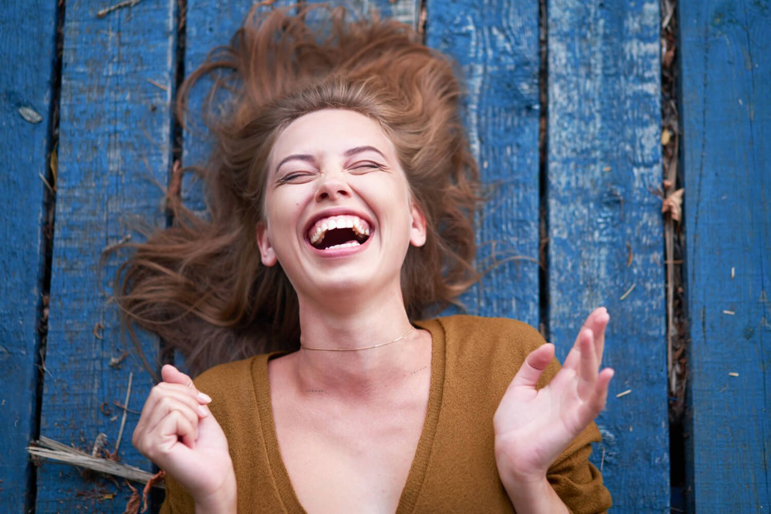 Person laughing, symbolizing the humor in life