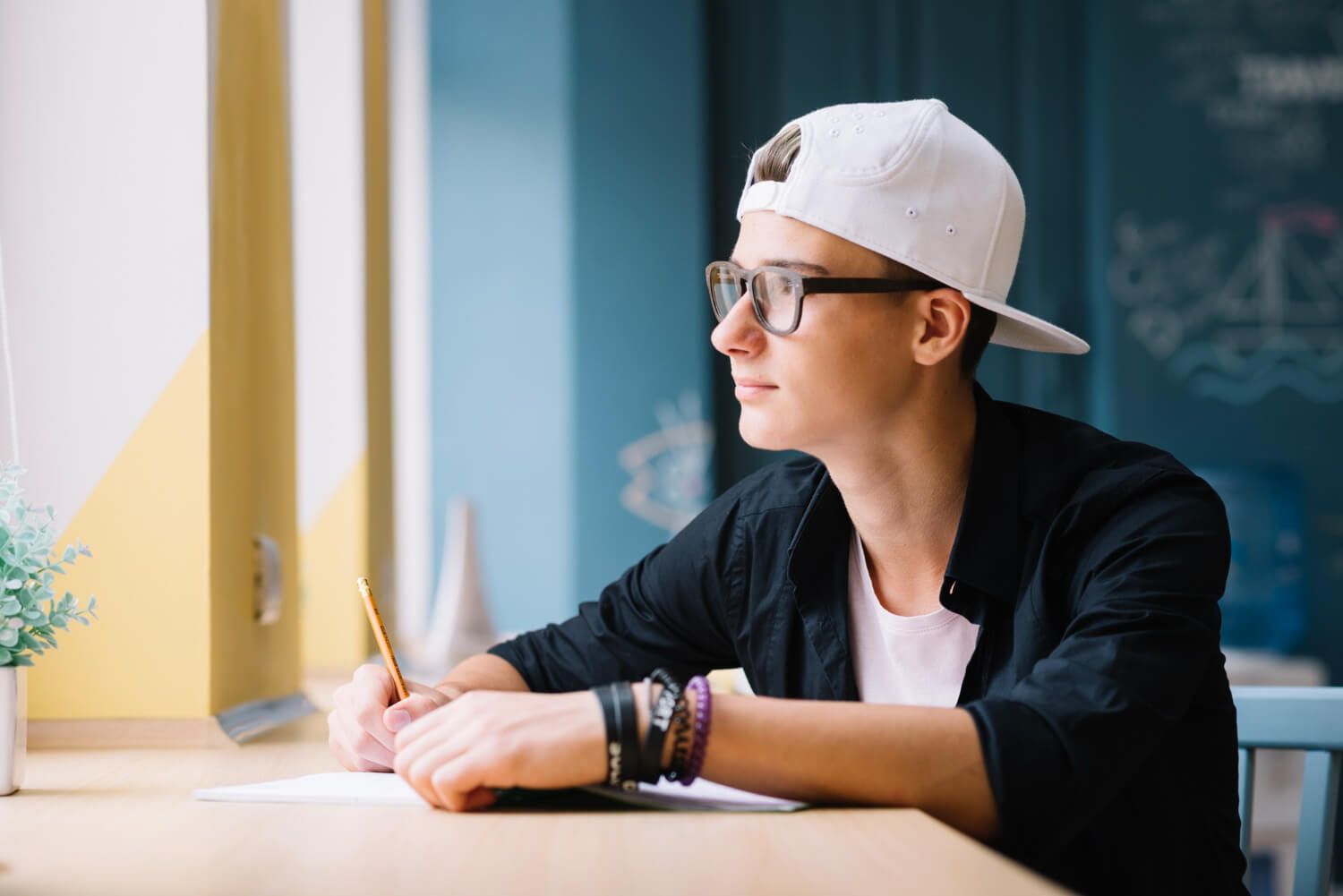 Thoughtful senior student looking into the distance