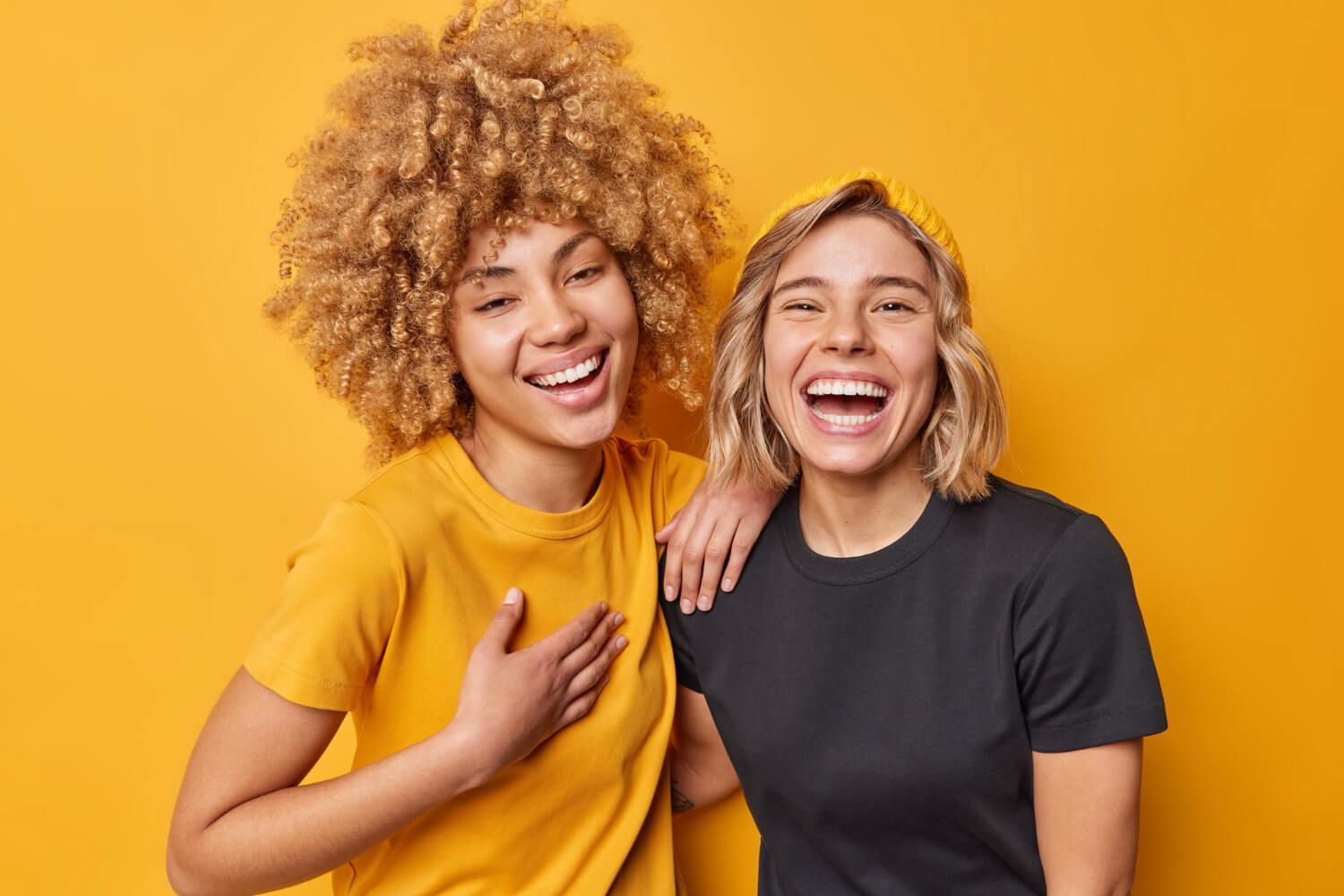 Two friends laughing together