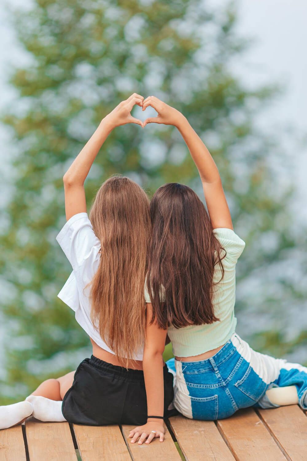 Two sisters embracing each other