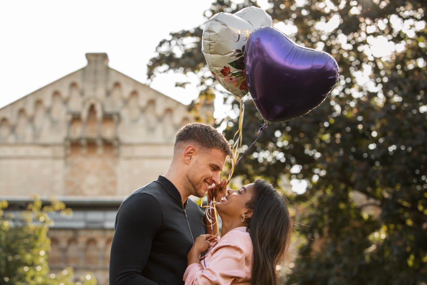 Young couple kissing during their first anniversary celebration.jpg