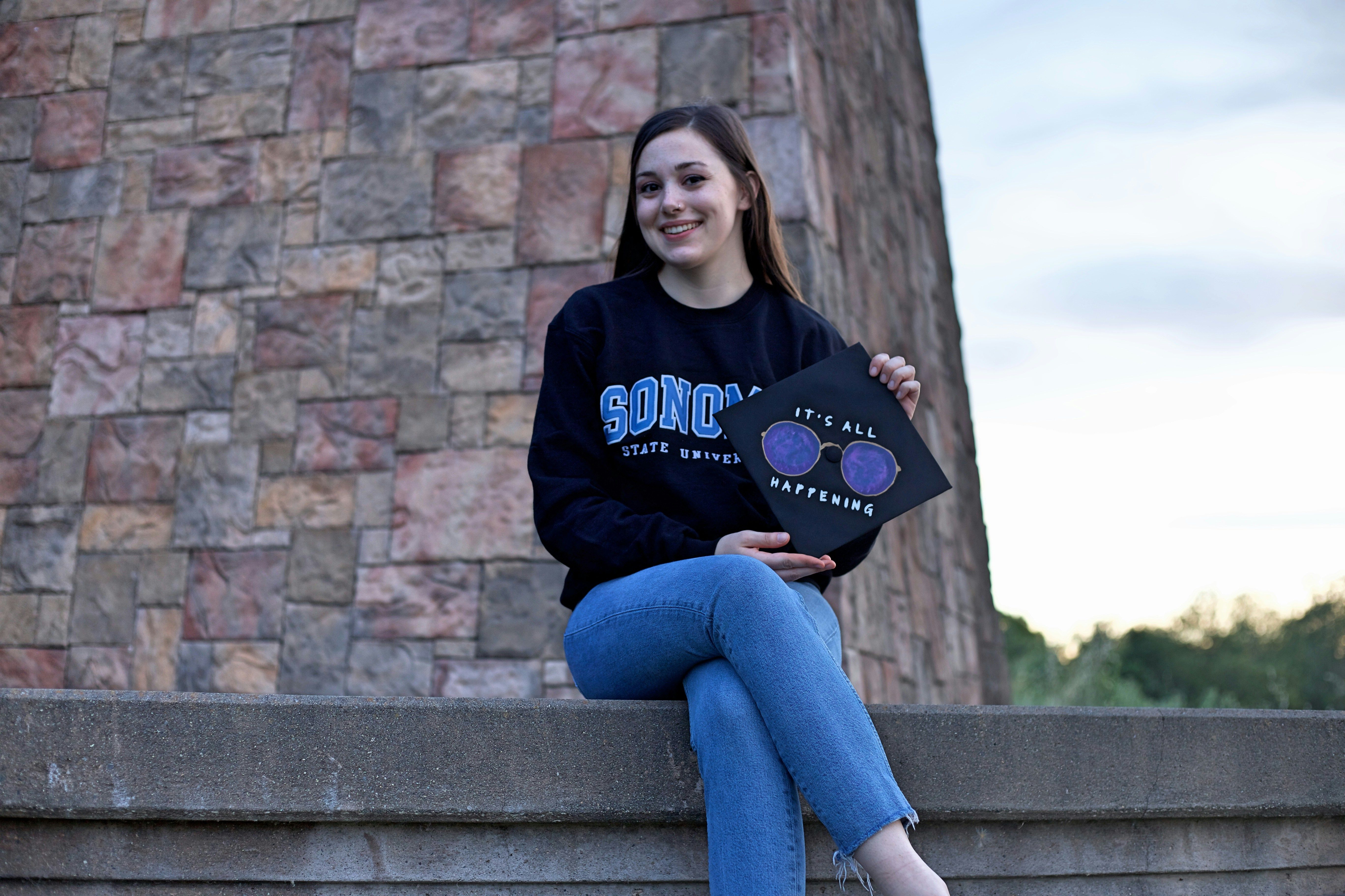 girl showing her graduation cap