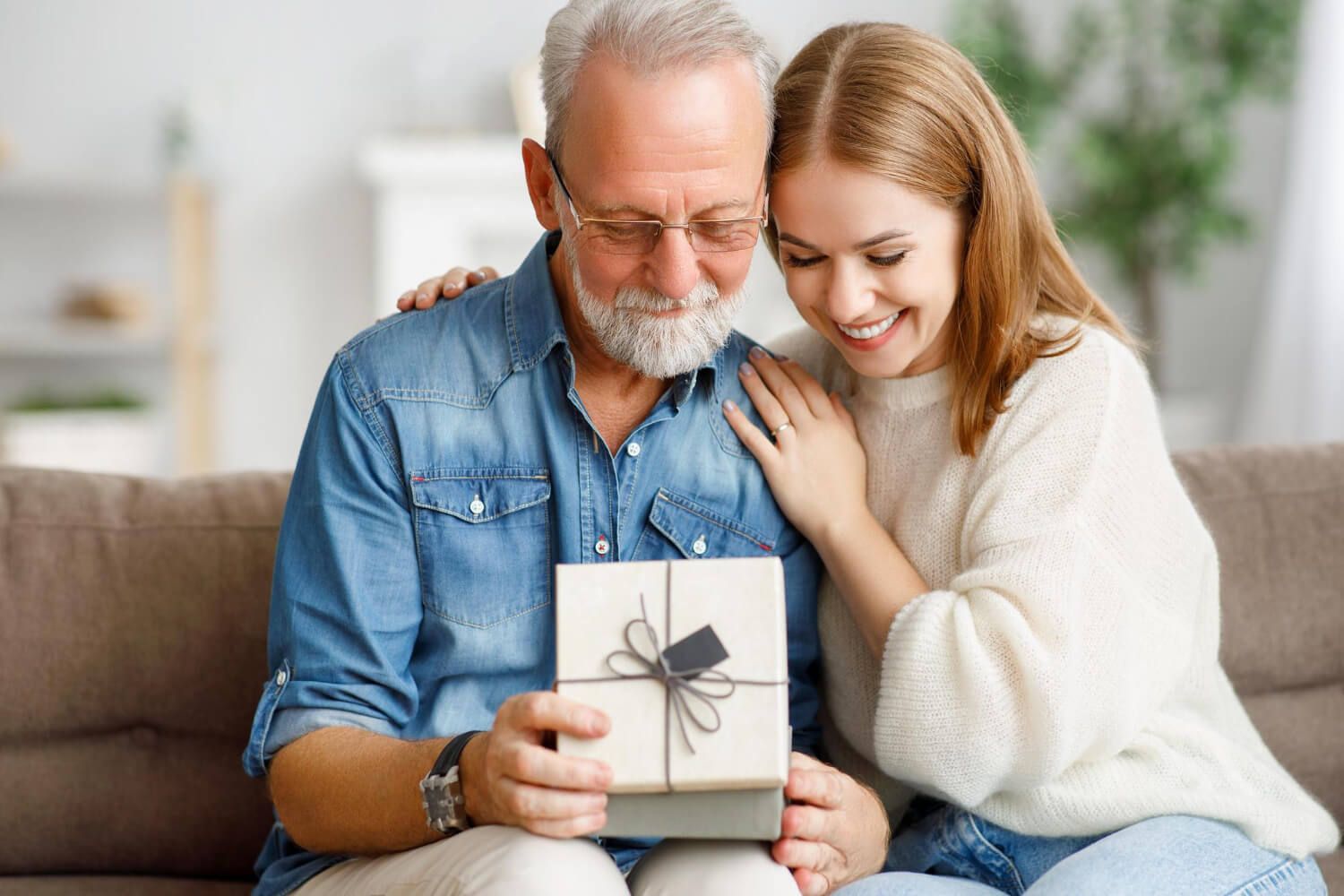 woman opening-present-box-during-holiday-celebration