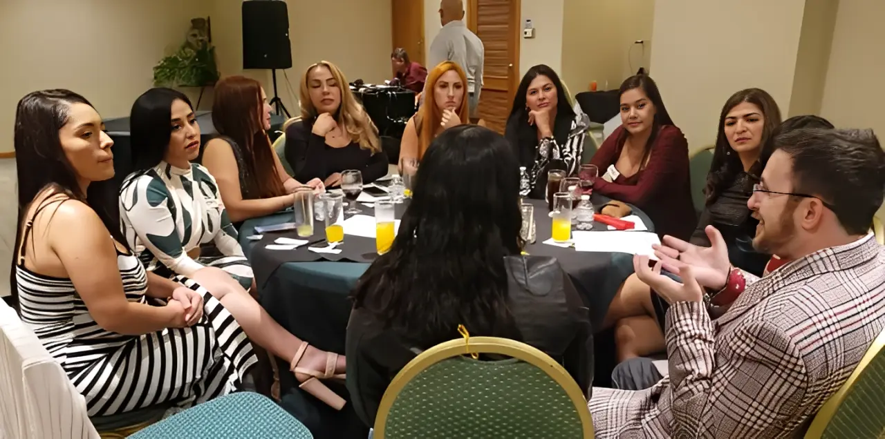 A single man sitting at a table while talking to single Costa Rican women