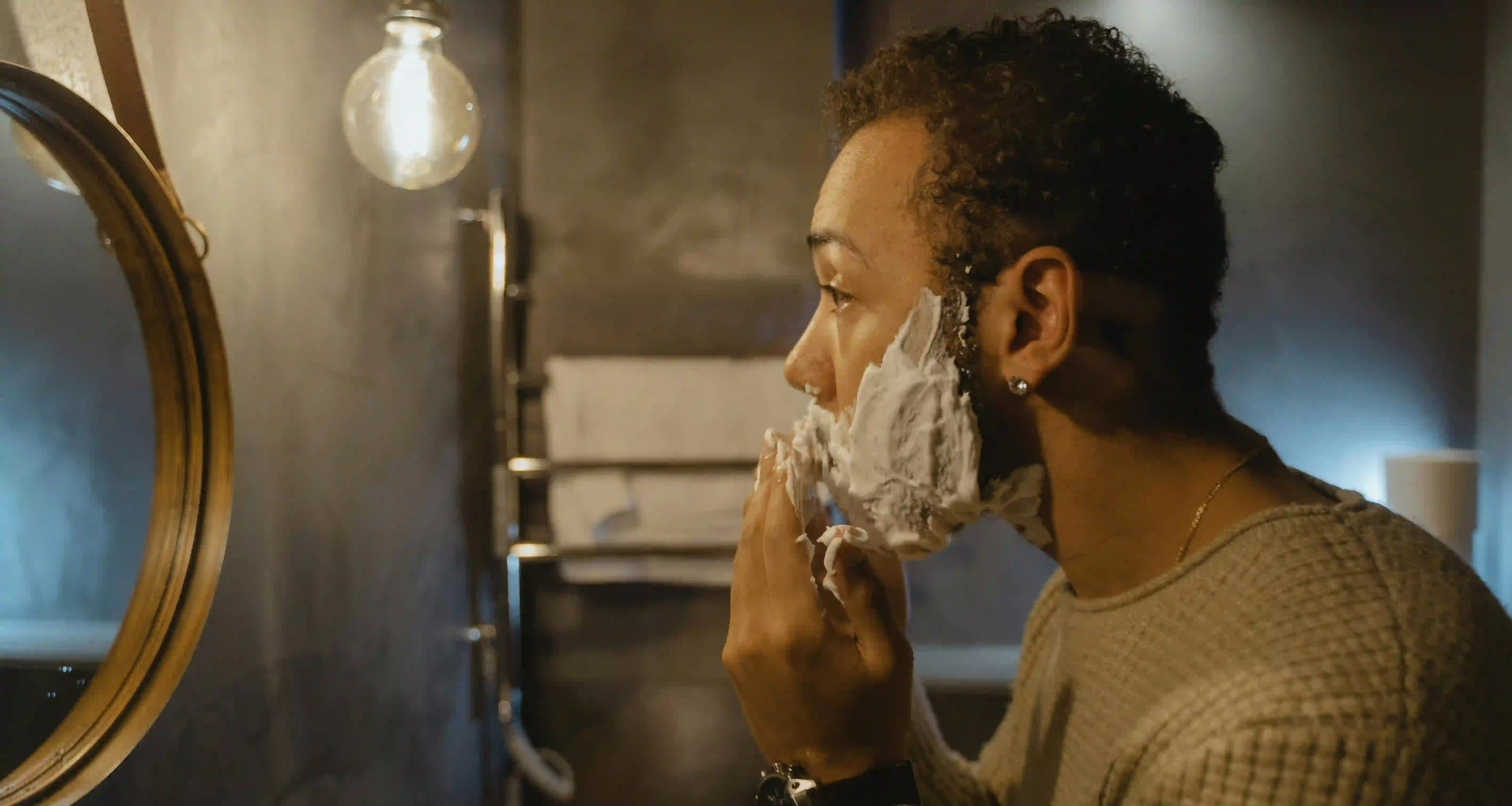 A man shaving his facial hair