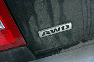 closeup of AWD badge on the rear of a black vehicle
