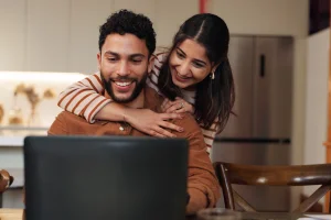 young couple excited because they are getting the best deal on extended warranty