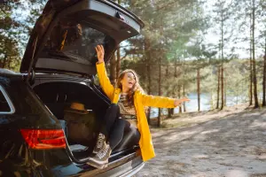 Woman in the back of an SUV who got the best extended warranty