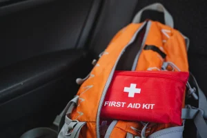 Car emergency kit including a first aid kit