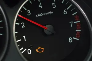 Vehicle instrument panel with check engine light on