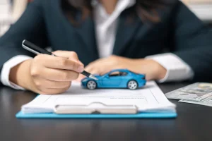 Photo illustration of lease buyout paperwork with an extended warranty bundled into the lease buyout financing
