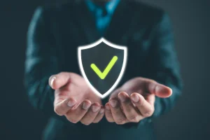 photo graphic of two hands cupping a shield with a check mark representing a total exclusionary warranty