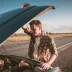Man in plaid shirt broken down on the side of the road with hood open and in need of car fix insurance