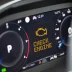 Close up of a car dashboard with a check engine light on caused by cooler fall temperatures