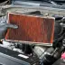 Image of a dirty orange car air filter