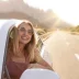 Happy female driver with an extended automobile warranty