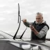 man changing out a pair of wiper blades on his car