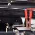 positive end of a jumper cable attached to a car battery