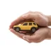yellow toy car being cupped by two hands