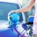 Blue piggy bank on top of a blue car