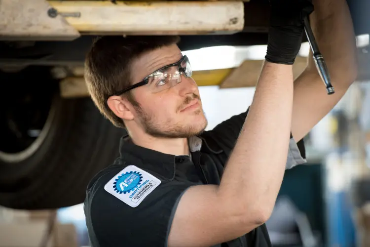 ASC certified mechanic working on a vehicle