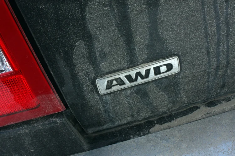closeup of AWD badge on the rear of a black vehicle