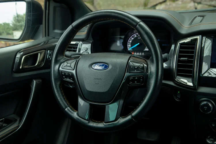 close up of a steering wheel in a Ford vehicle