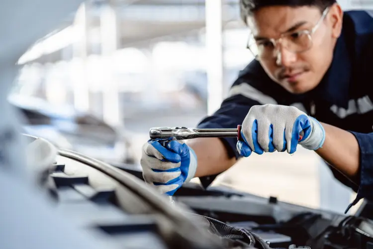 Mechanic working on vehicle