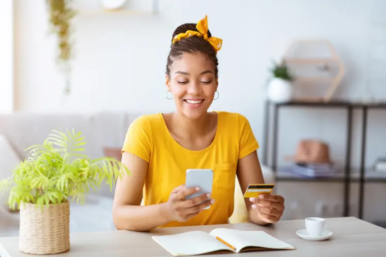 Woman buying an extended warranty plan with monthly payments on her phone