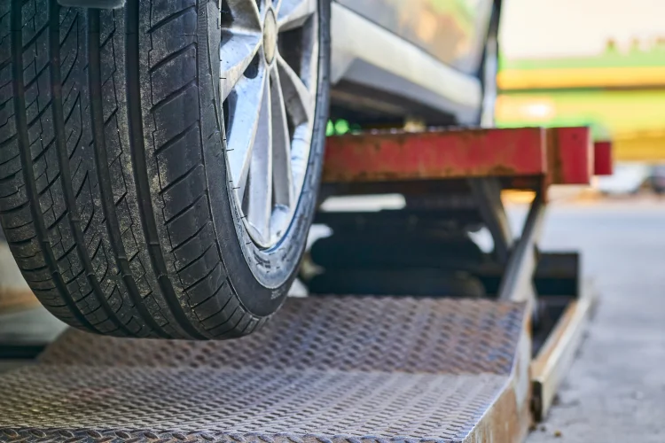 Car with an extended warranty being towed using roadside assistance