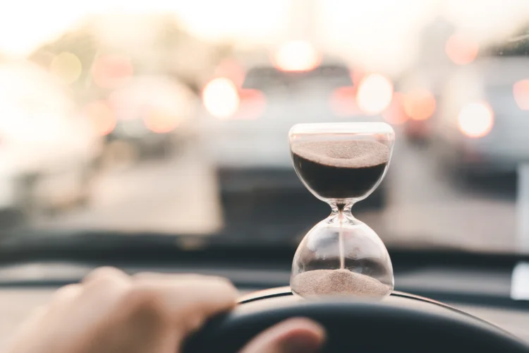 hourglass sitting on top of a car dash