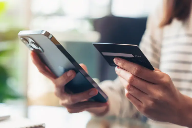 Woman buying an affordable extended warranty on her phone through the Cuvrd platform