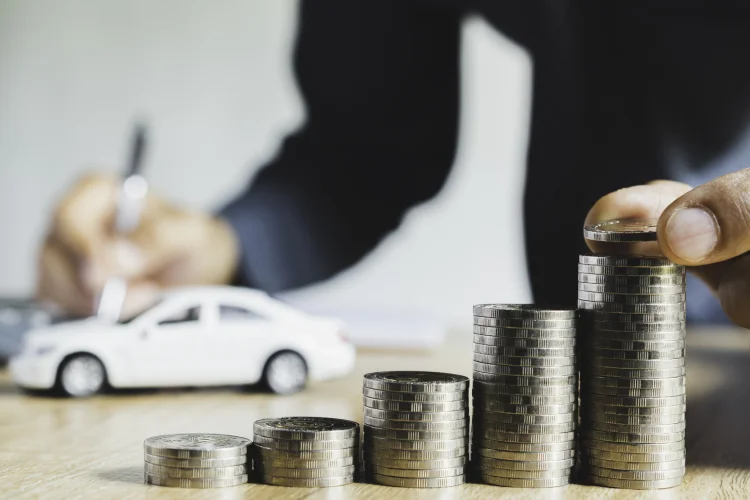 Graphic depicting the cost of an extended warranty with stacks of change and a toy car