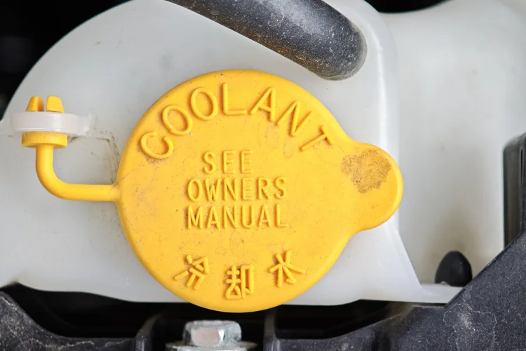 close up of a coolant reservoir cap