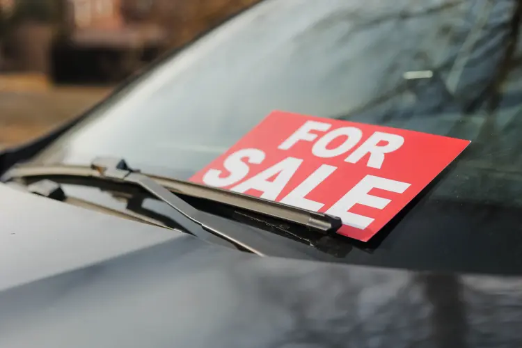 for sale sign in the window of a car with an active extended warranty