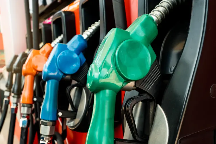 Row of colorful gas pump nozzles